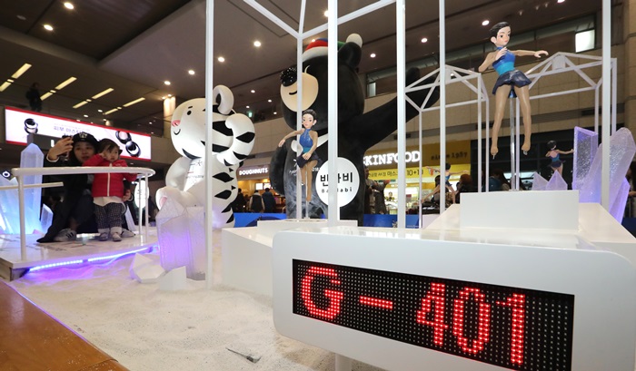 Visitors take a photo in front of the 2018 Olympics mascots installed at the Incheon International Airport on Jan. 4, 2017.